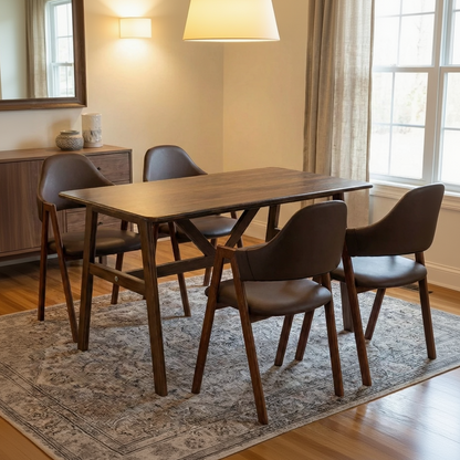Dining room with wooden table and chairs on a rug, sideboard, and window.